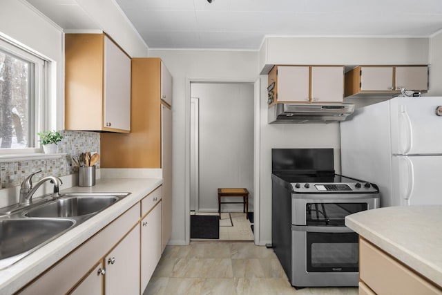 kitchen with sink, double oven range, backsplash, white refrigerator, and ornamental molding