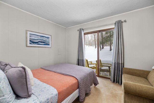 carpeted bedroom with crown molding and a textured ceiling