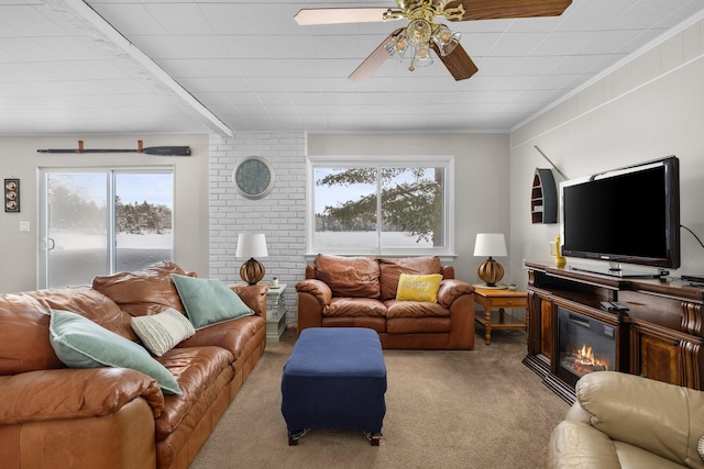 carpeted living room featuring ceiling fan