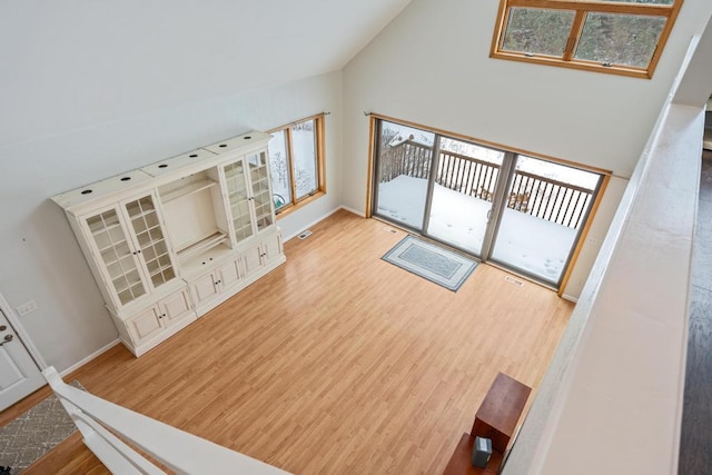 living room with lofted ceiling and light hardwood / wood-style floors