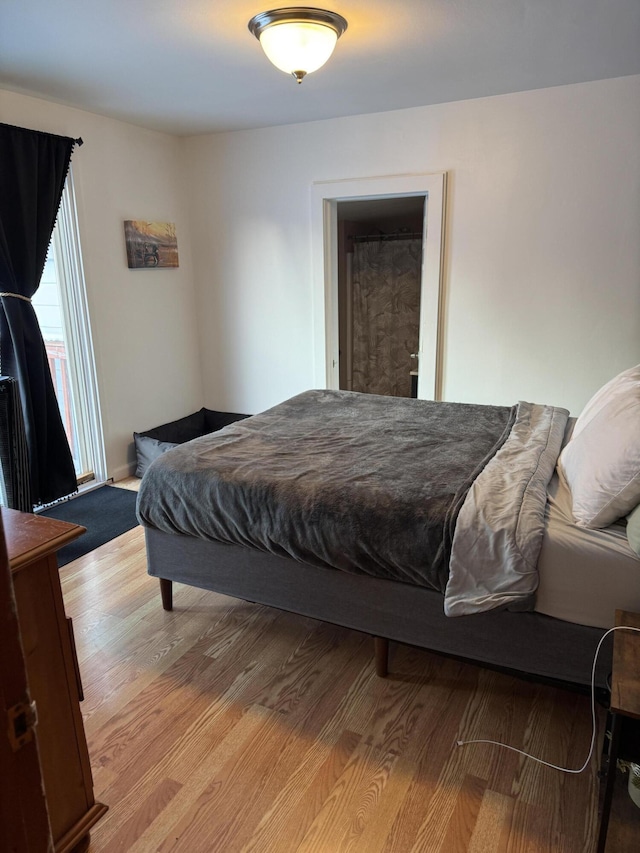 bedroom with light hardwood / wood-style flooring