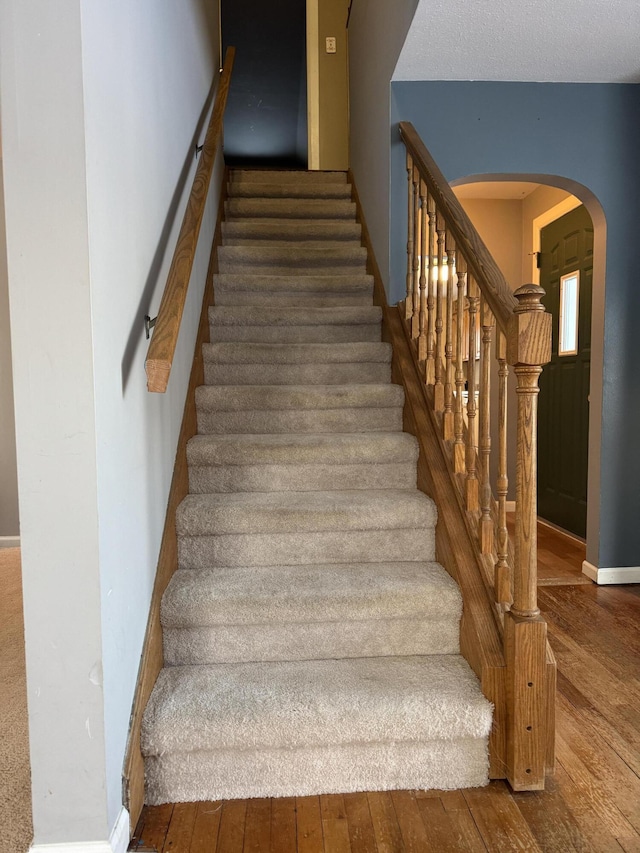 stairway with wood-type flooring