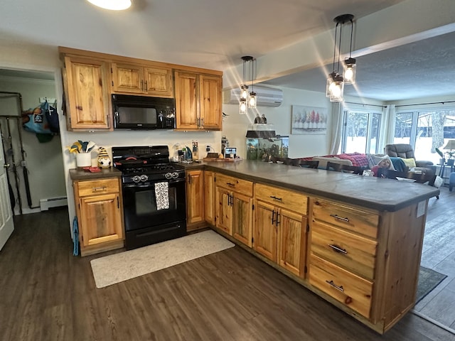 kitchen featuring decorative light fixtures, black appliances, dark hardwood / wood-style flooring, kitchen peninsula, and a baseboard heating unit