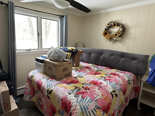 bedroom with crown molding and baseboard heating