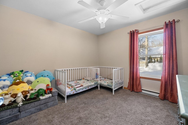 unfurnished bedroom featuring ceiling fan, carpet floors, and a baseboard heating unit