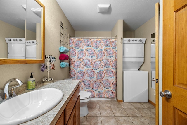 bathroom featuring stacked washer and dryer, vanity, toilet, tile patterned floors, and a shower with curtain