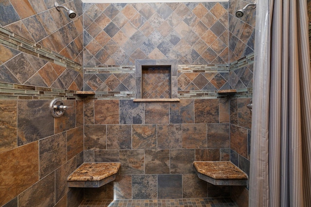 bathroom featuring a tile shower