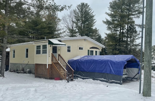 view of snow covered property