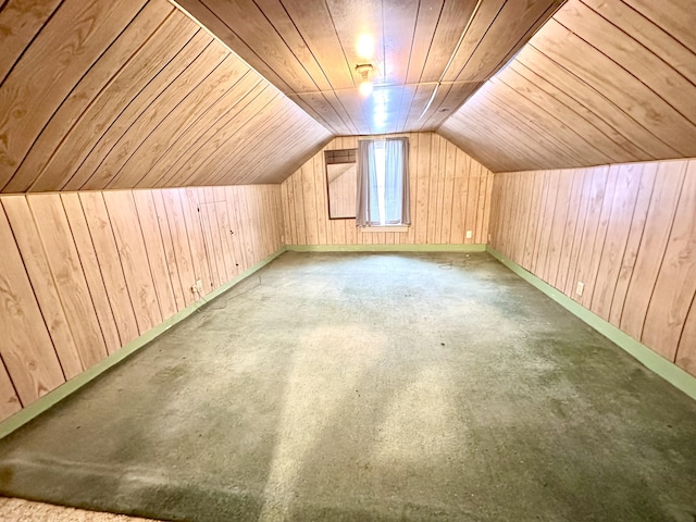 bonus room with lofted ceiling, wooden walls, and wooden ceiling