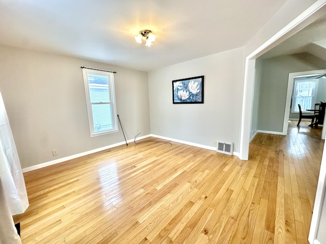 spare room featuring light hardwood / wood-style flooring