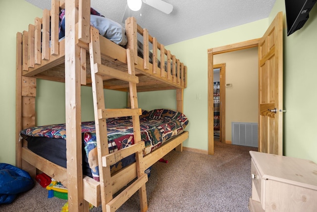 bedroom with carpet flooring and a textured ceiling