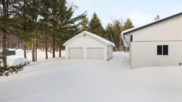 view of snow covered garage