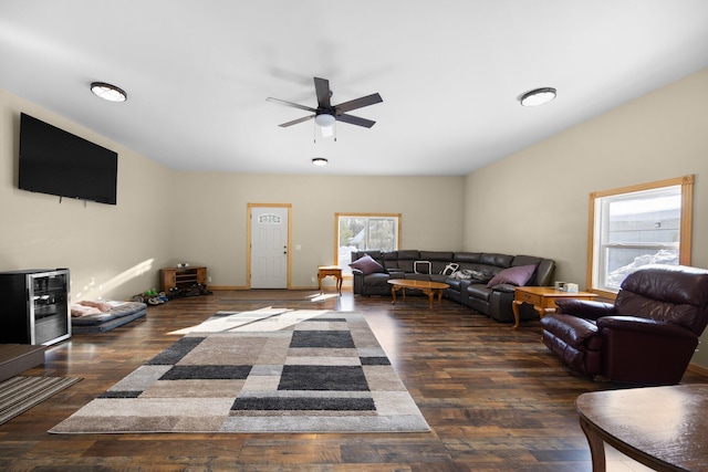 living room with dark wood-type flooring, beverage cooler, and ceiling fan