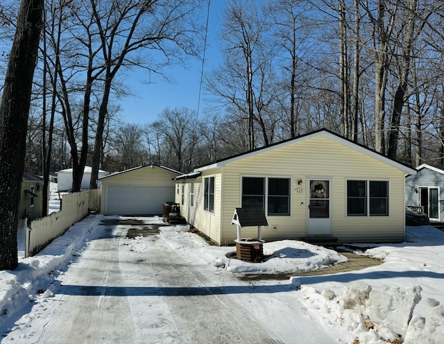 view of front of property with an outbuilding, fence, and entry steps