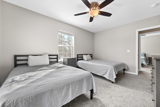 bedroom featuring light colored carpet and ceiling fan