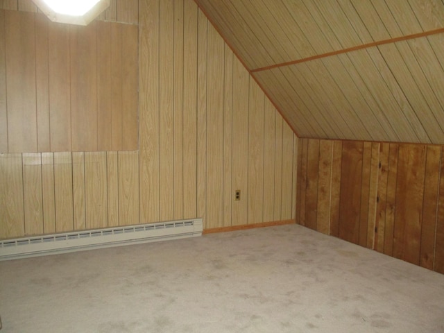 bonus room with lofted ceiling, carpet floors, a baseboard radiator, and wooden walls