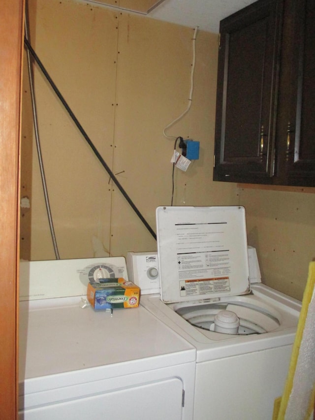 washroom with independent washer and dryer