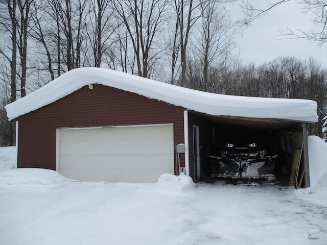 view of snow covered garage