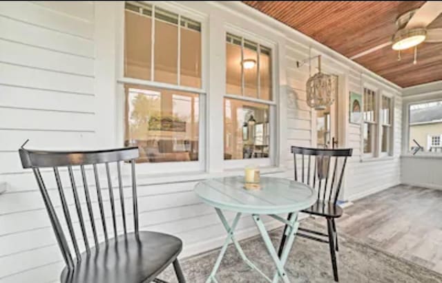 sunroom / solarium featuring wood ceiling