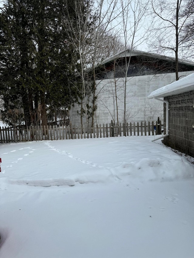 view of yard layered in snow