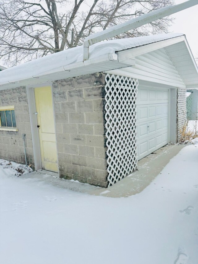 view of snow covered garage