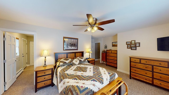 carpeted bedroom with ceiling fan, baseboards, and baseboard heating