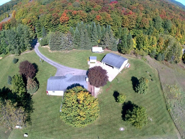 drone / aerial view with a view of trees