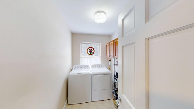 laundry room featuring cabinet space and separate washer and dryer