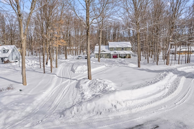 view of yard layered in snow