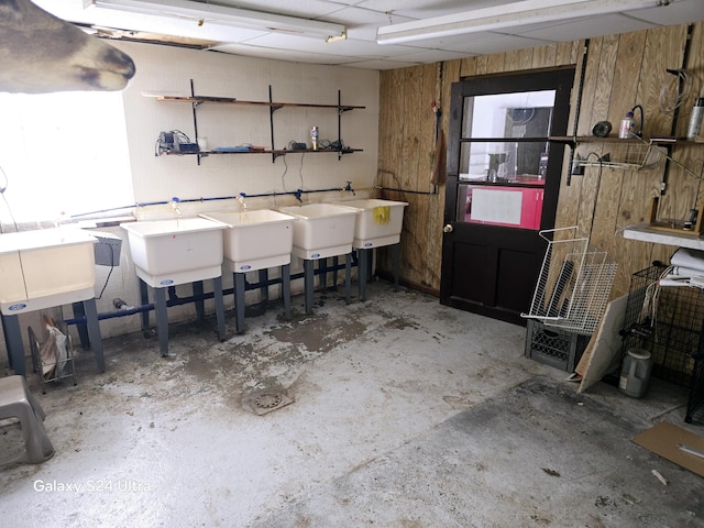 interior space with wooden walls and sink