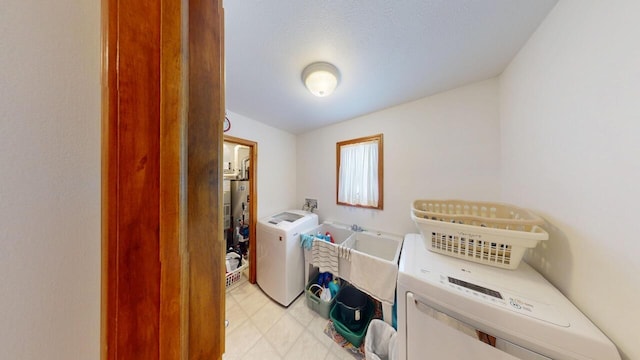 laundry room featuring washing machine and dryer and laundry area