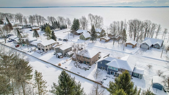 snowy aerial view featuring a residential view