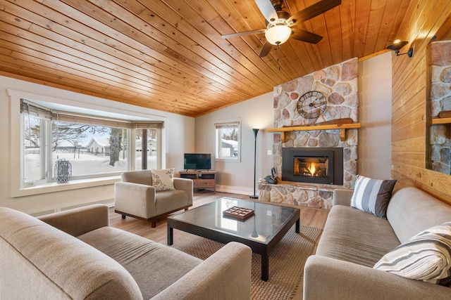 living room featuring a fireplace, a ceiling fan, wood ceiling, vaulted ceiling, and light wood-type flooring