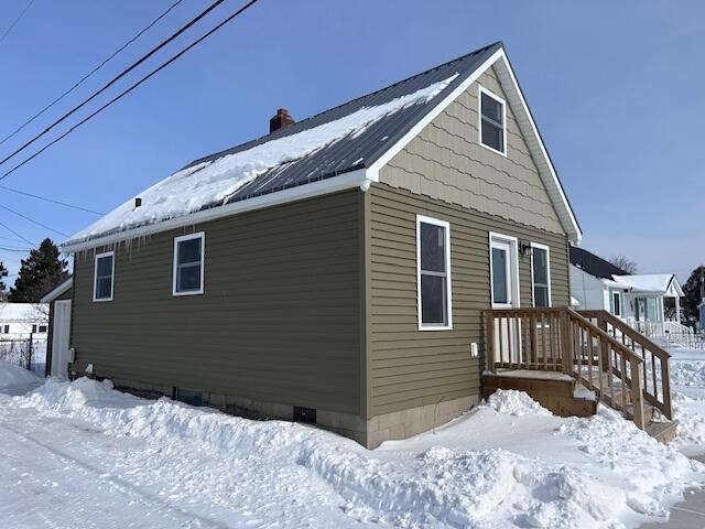 view of snow covered property