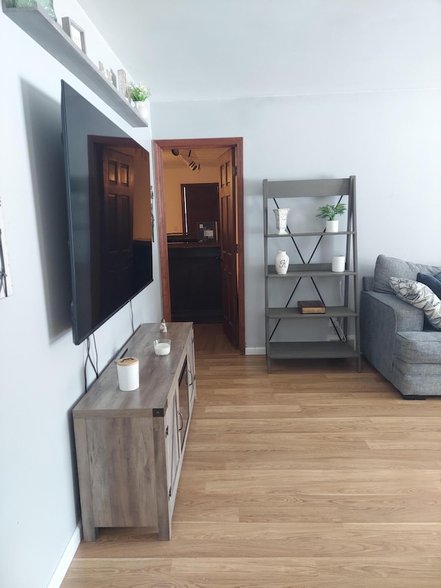 hall with light hardwood / wood-style flooring