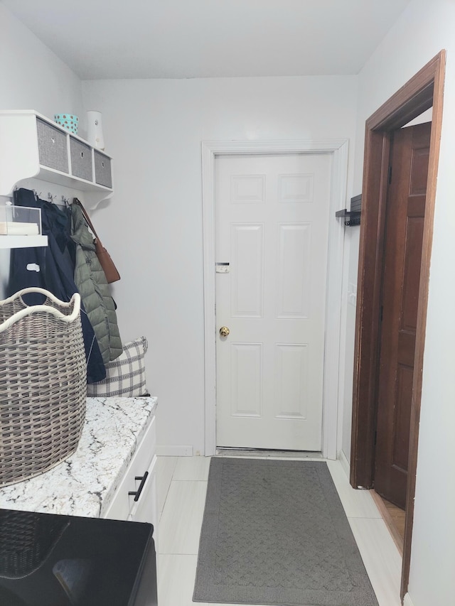 mudroom with light tile patterned flooring