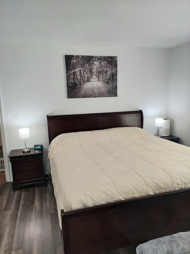 bedroom featuring dark hardwood / wood-style flooring