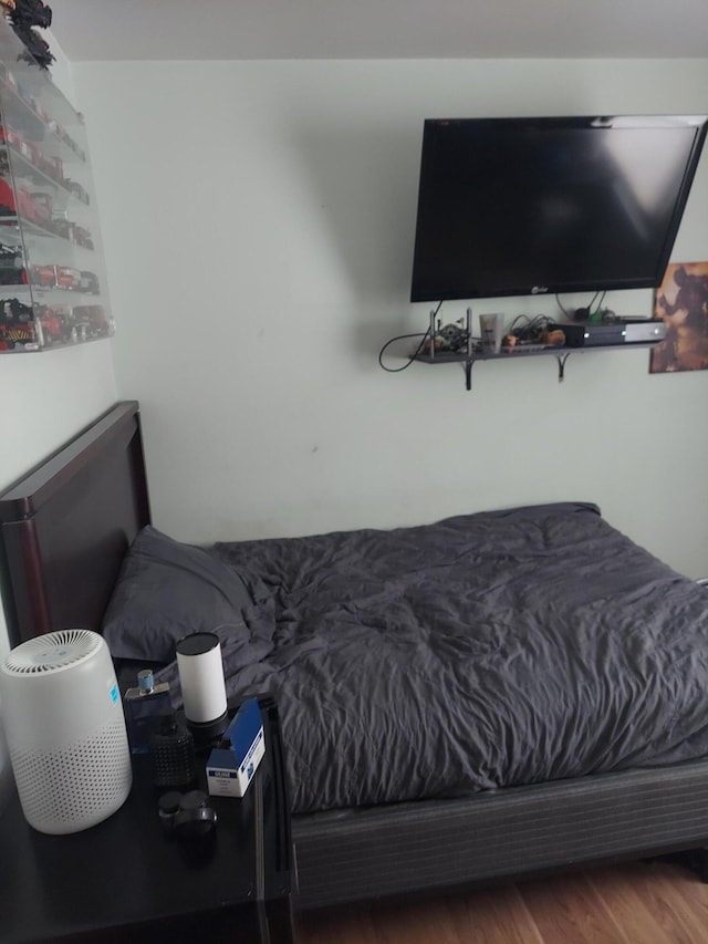 bedroom with wood-type flooring