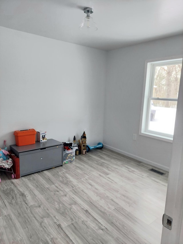 unfurnished room featuring light wood-type flooring