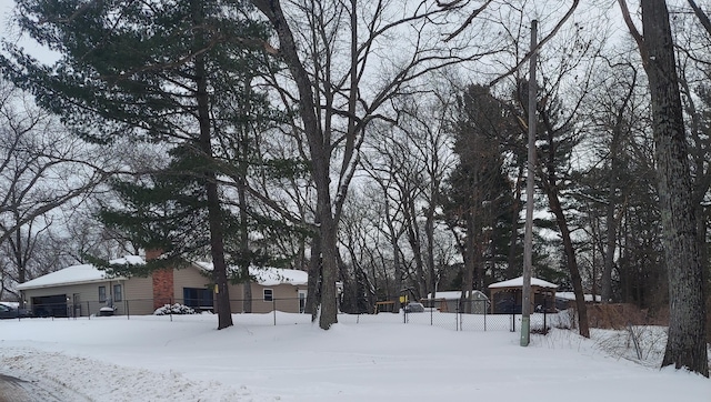 view of yard layered in snow