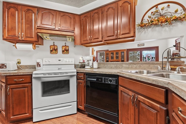 kitchen with electric stove, sink, dishwasher, a textured ceiling, and light hardwood / wood-style floors