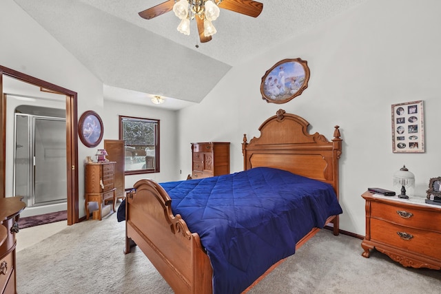 carpeted bedroom with a textured ceiling, vaulted ceiling, and ceiling fan