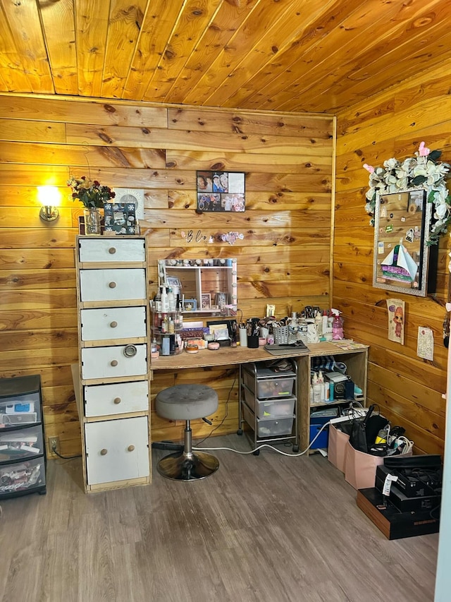 office with wood walls, wood ceiling, and wood finished floors