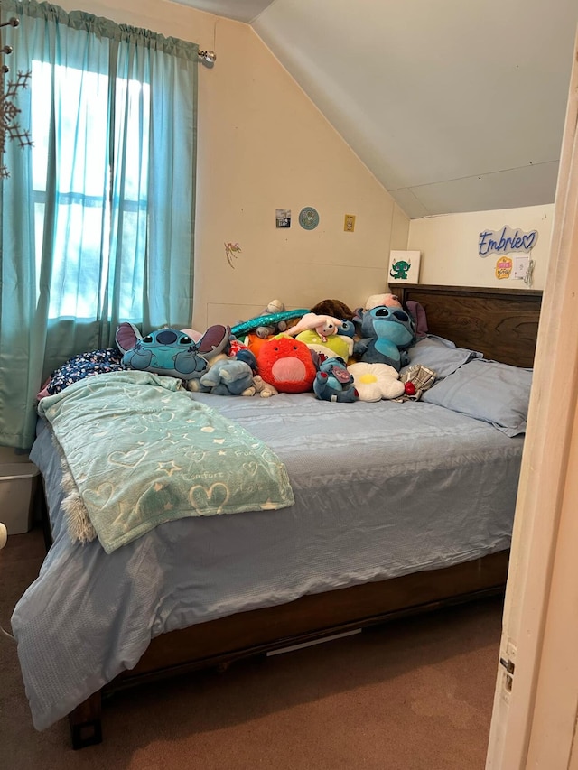 bedroom featuring lofted ceiling