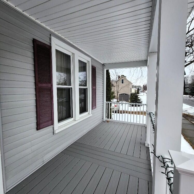 view of snow covered deck