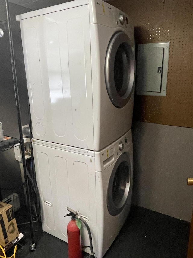 laundry area with stacked washer / drying machine