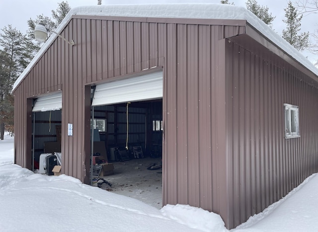 view of snow covered garage