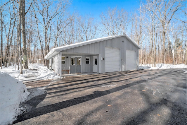 exterior space featuring an outbuilding and a detached garage