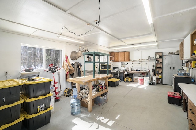 garage with a workshop area