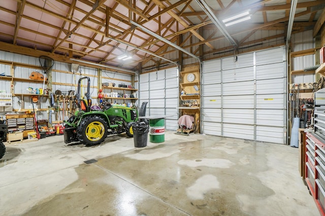 garage with a workshop area and metal wall